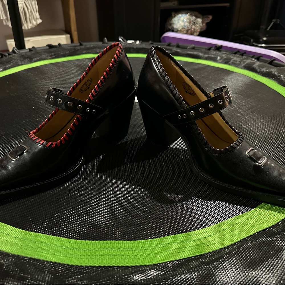 John Fluevog Black Heels oNE of a KIND with Red Trim only on one of the shoes.